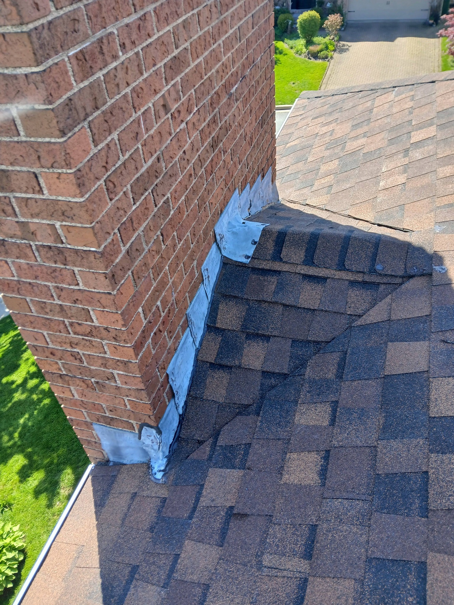 Roof repair — replacing damaged shingles and resealing flashing — by Maxwell Roofing in the Halifax area, Nova Scotia