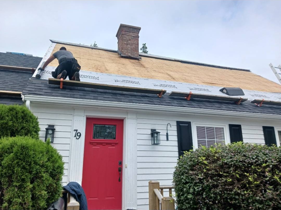 Re-roofing project with new architectural shingles replacing old layers, by Maxwell Roofing in the Halifax area, Nova Scotia