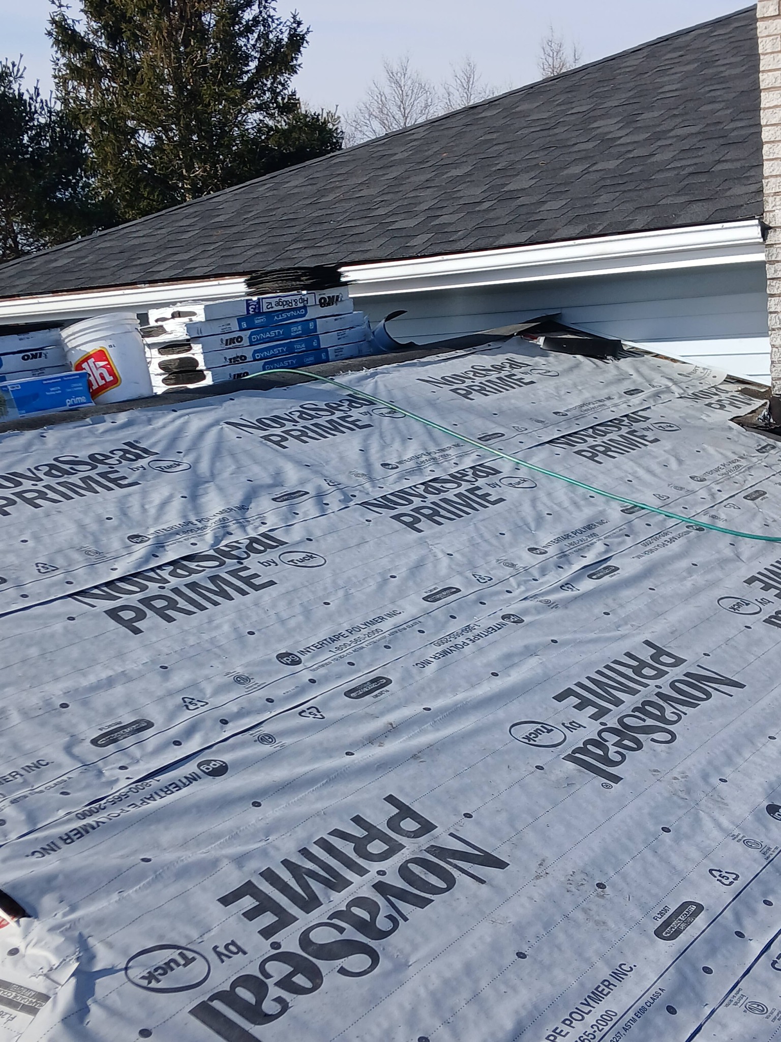 Wind and storm damage repair on a residential roof, documented by Maxwell Roofing in Nova Scotia